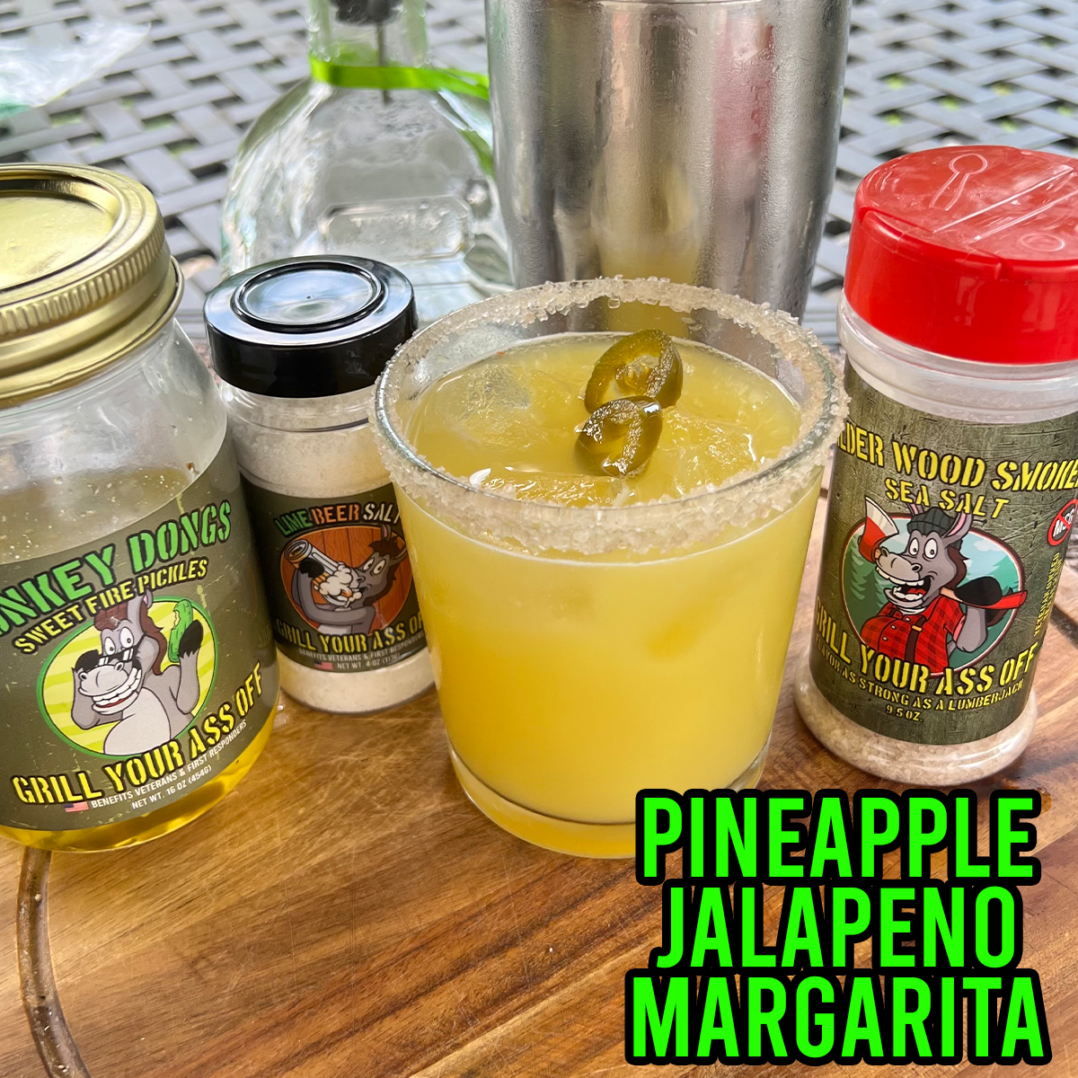 Pineapple Jalapeno Margarita topped with Donkey Dongs and with Lime beer salt and Alder Wood Smoked Sea Salt