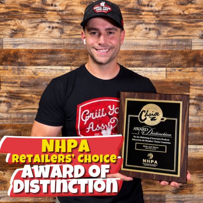 Grill Your Ass Off founder Jason Murff holding the NHPA Retailers’ Choice Award of Distinction plaque for Rubs and Spices.